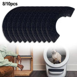 Set of black pet hair removal pads with a chair and pet litter box in the background.