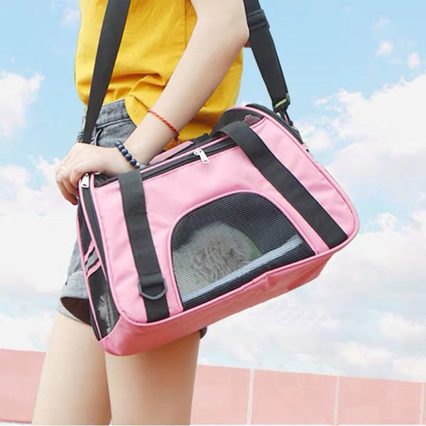 alt = "A person with a portable breathable pet bag for cats, rabbit and dogs"